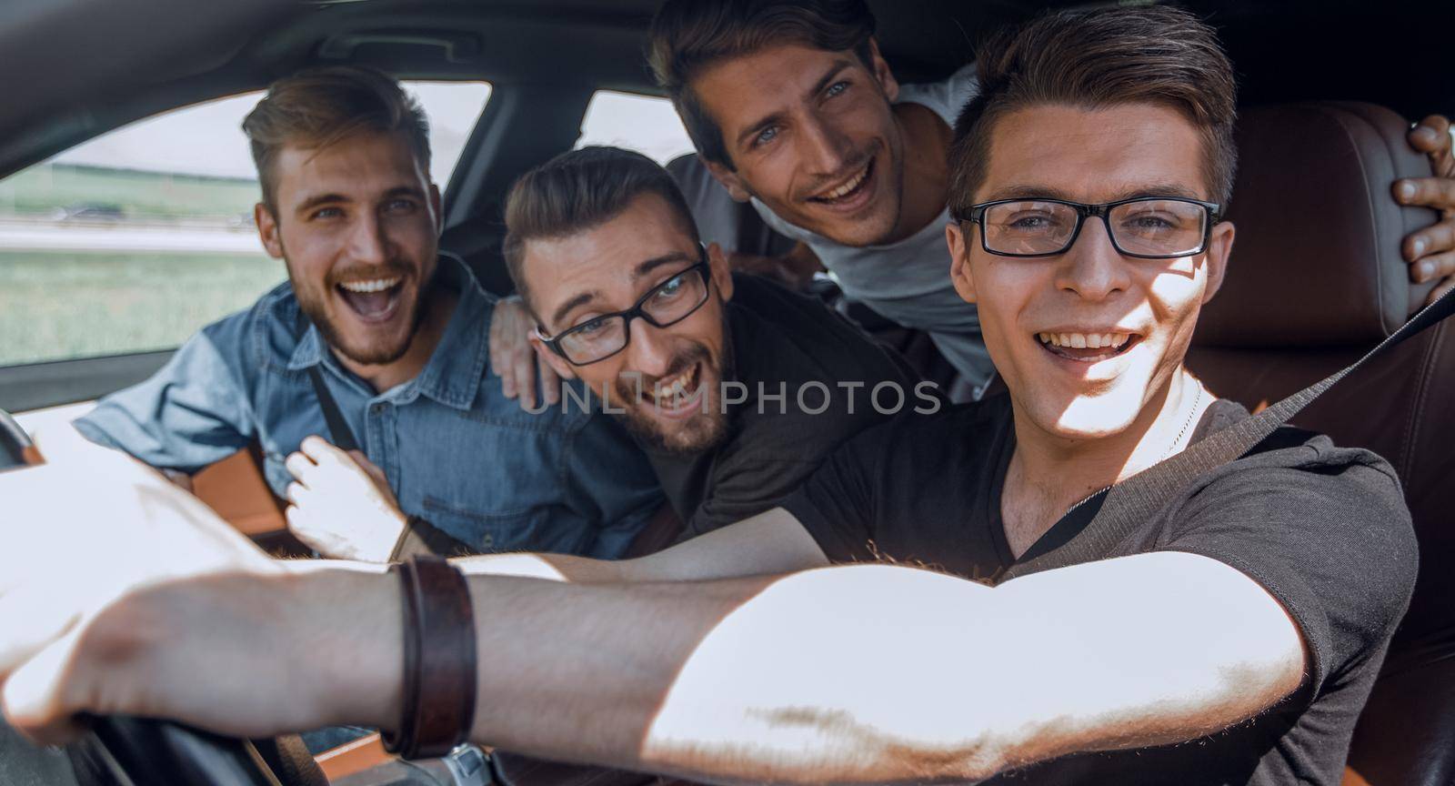 Group Of Friends In Car On Road Trip . joint trip