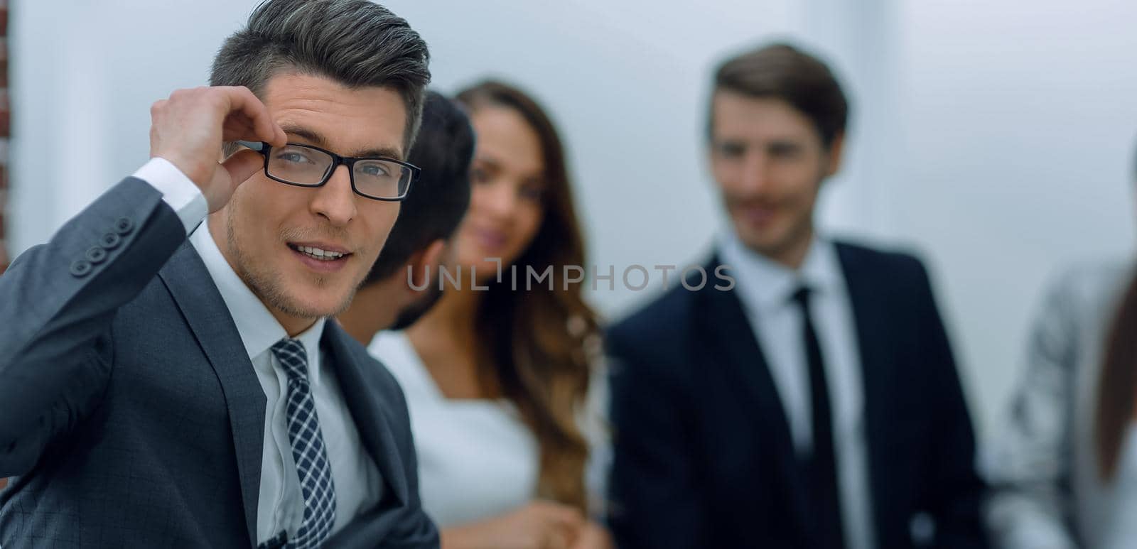 smiling businessman in the workplace. business people