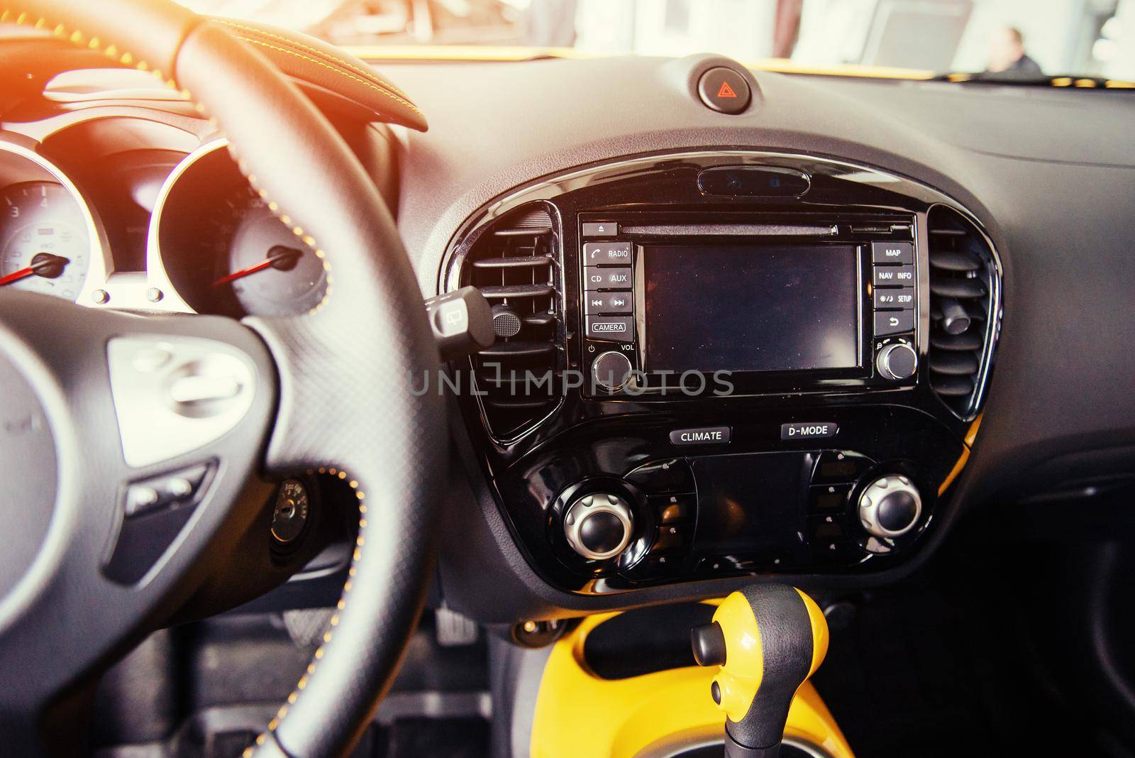Modern car interior dashboard and steering wheel.