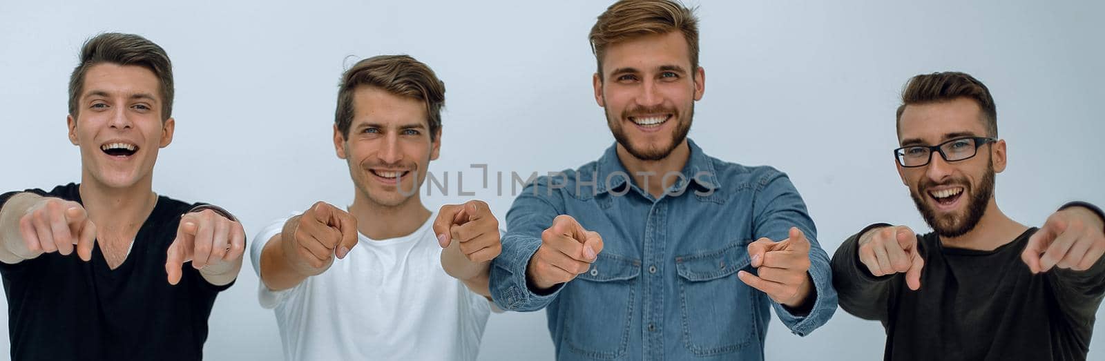 group of young people are pointing at you.isolated on white background