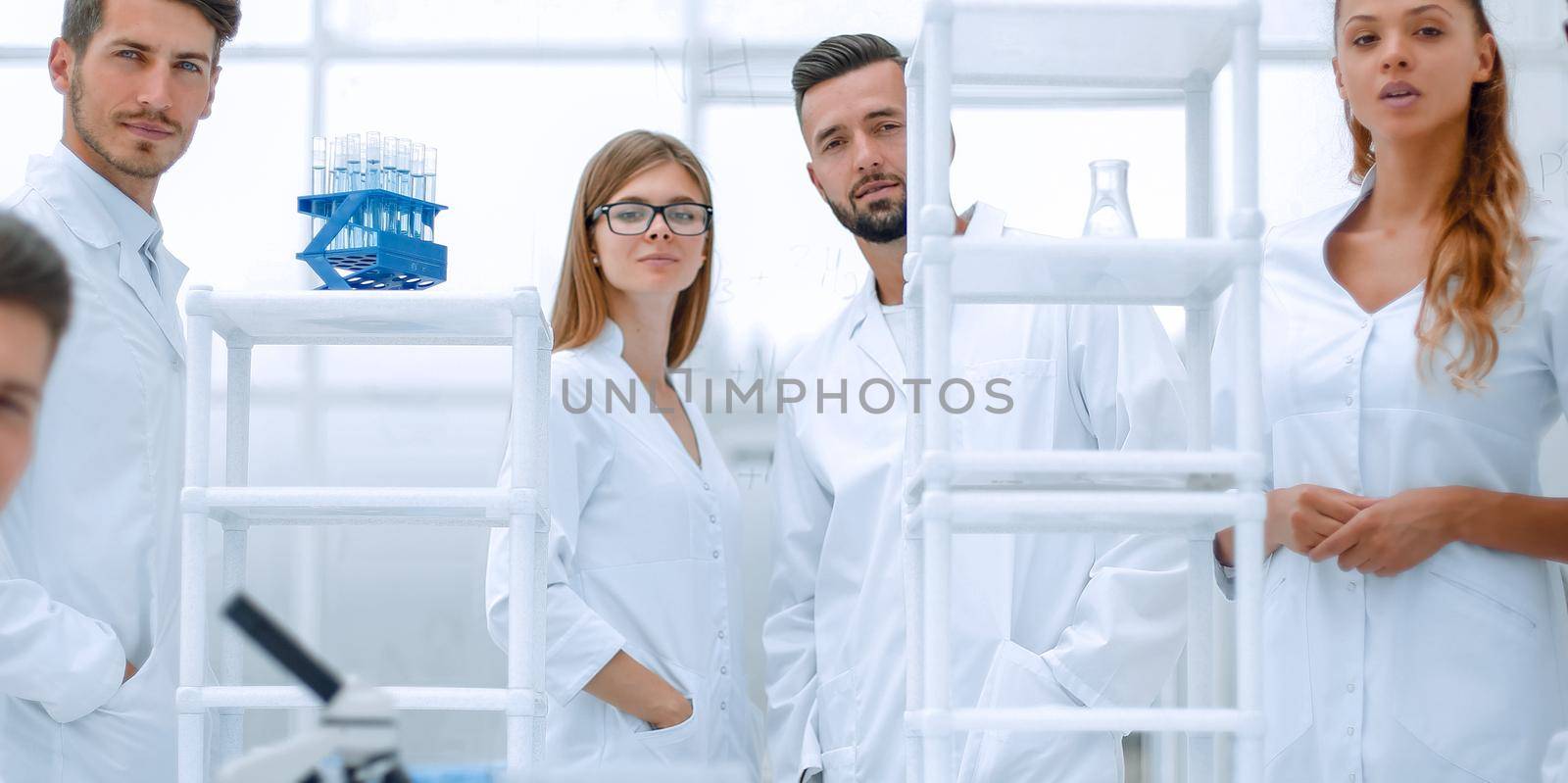 Team In Laboratory Doing Research, Man And Woman Making Scientific Experiments Doctors In Lab