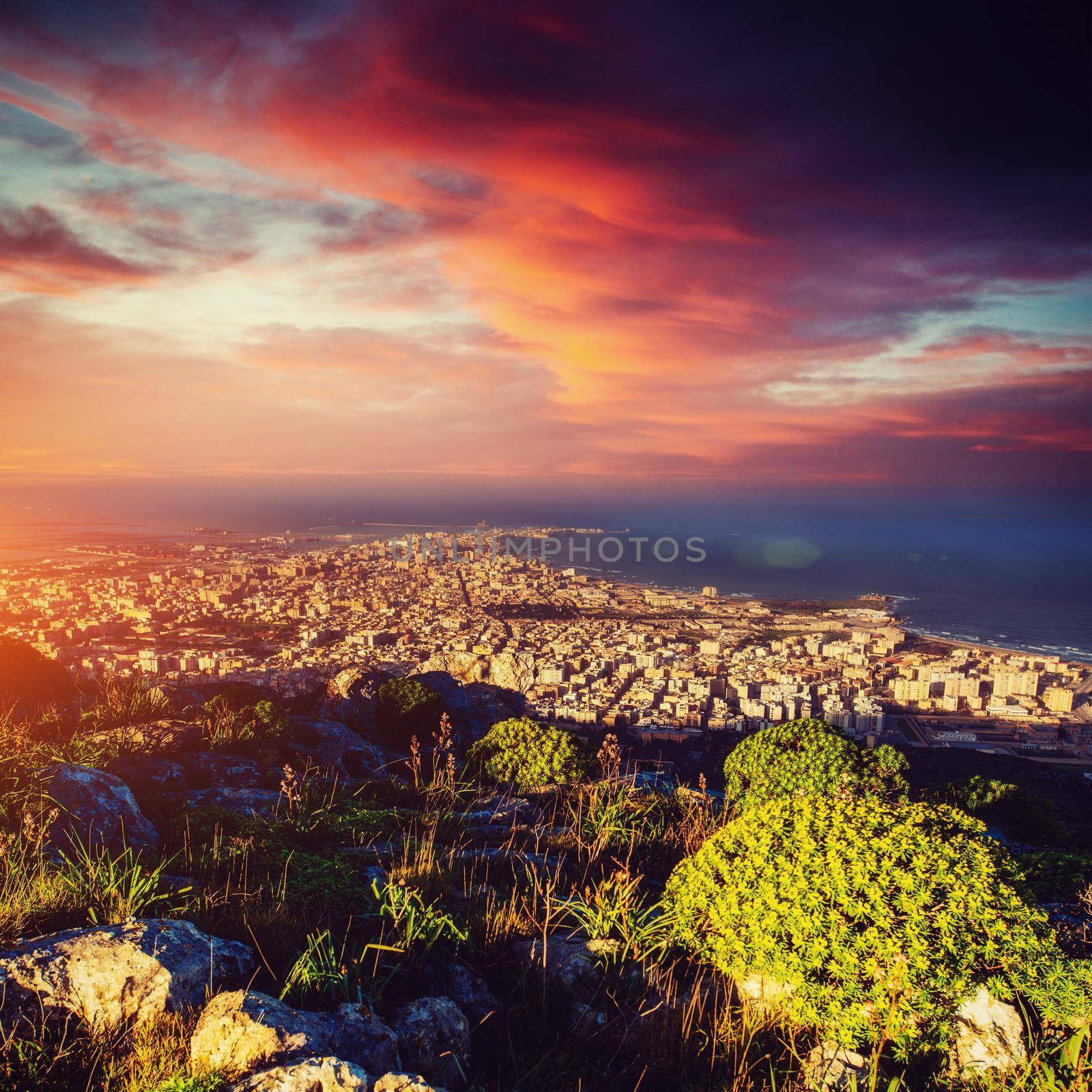 Fantastic view of the nature reserve Monte Cofano. Dramatic scene. Sunset over sea. Location cape San Vito. Sicilia, Italy, Europe. Mediterranean and Tyrrhenian sea.