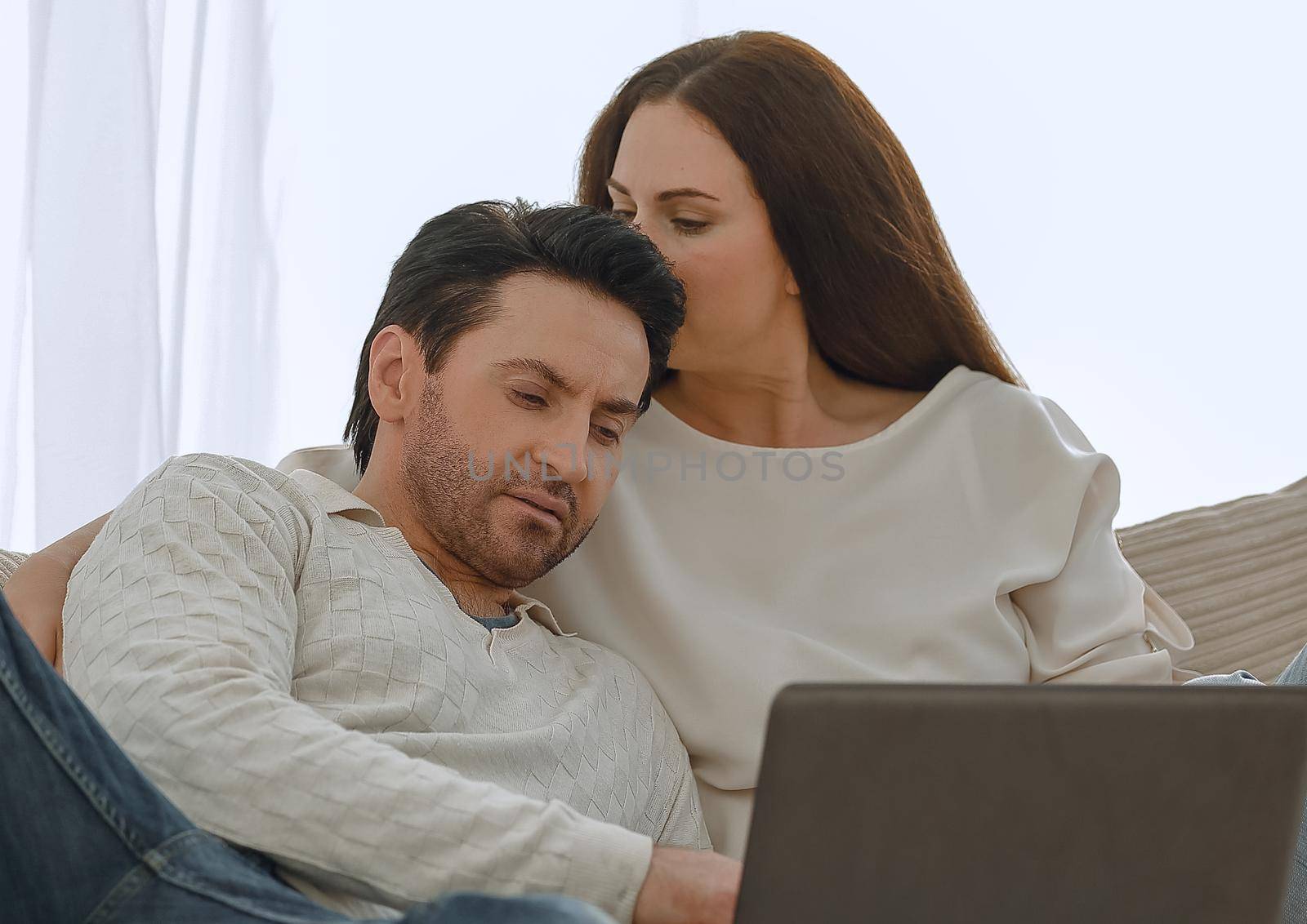 close up.young couple looking at laptop screen. by asdf