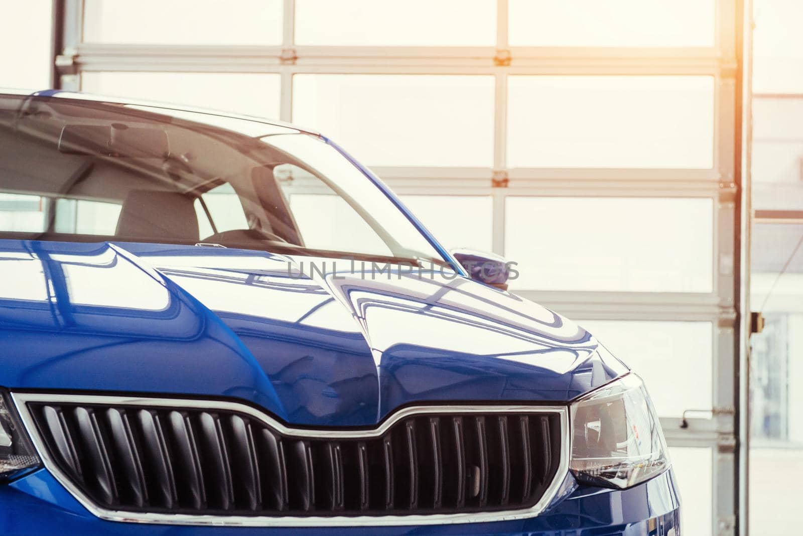 The headlights and hood Blue sports car