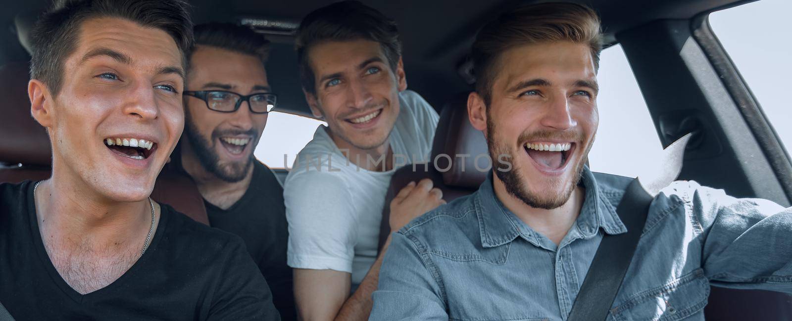 close up. three friends travel in a car by asdf