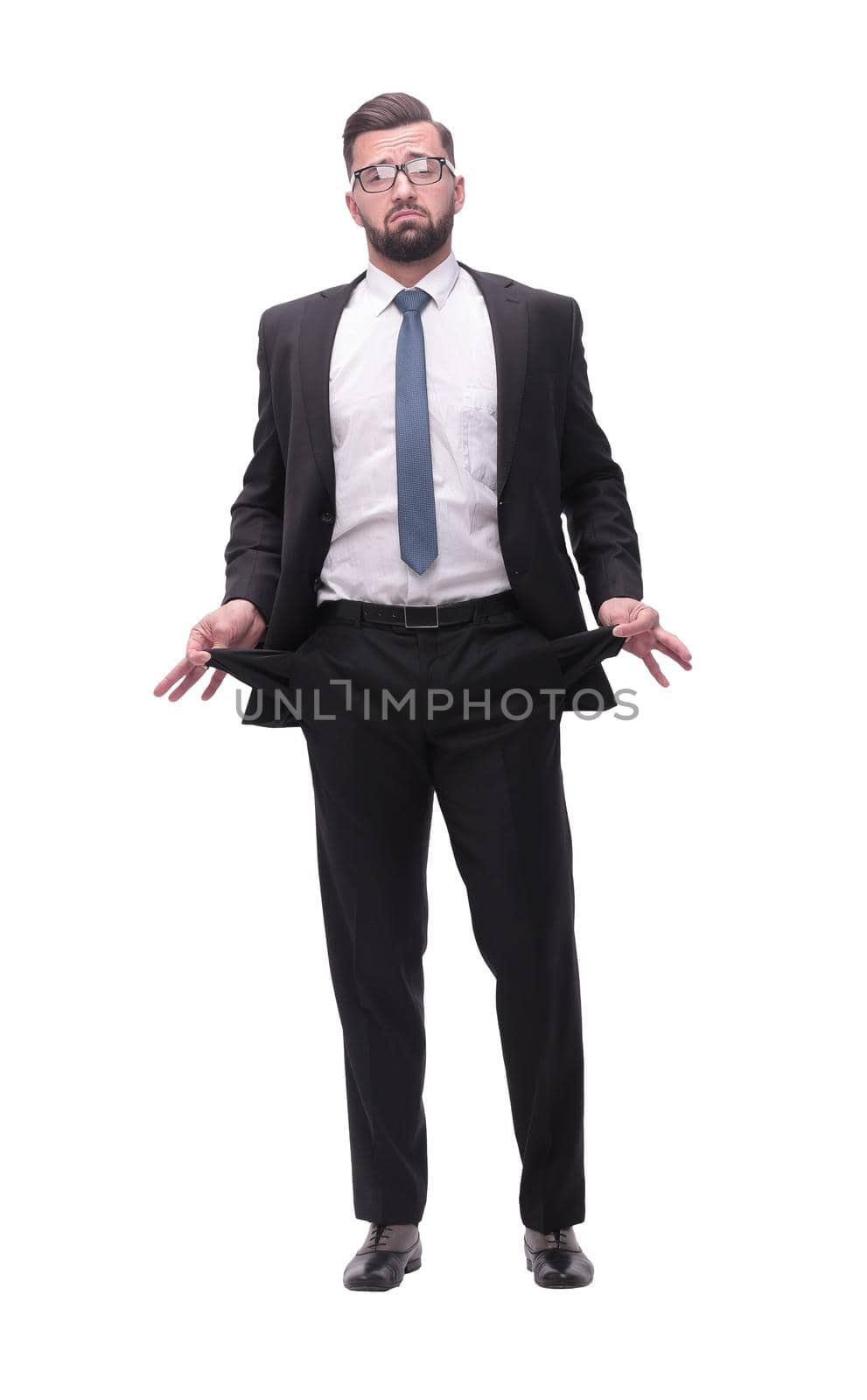 in full growth. frustrated businessman showing his empty pockets by asdf