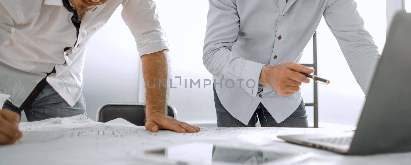 two architects use a laptop for work. photo with copy space