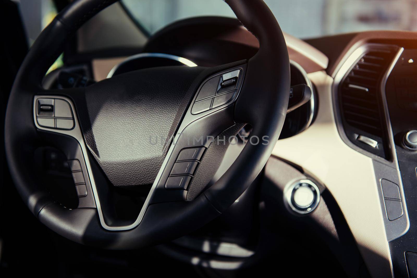 Modern car interior dashboard and steering wheel