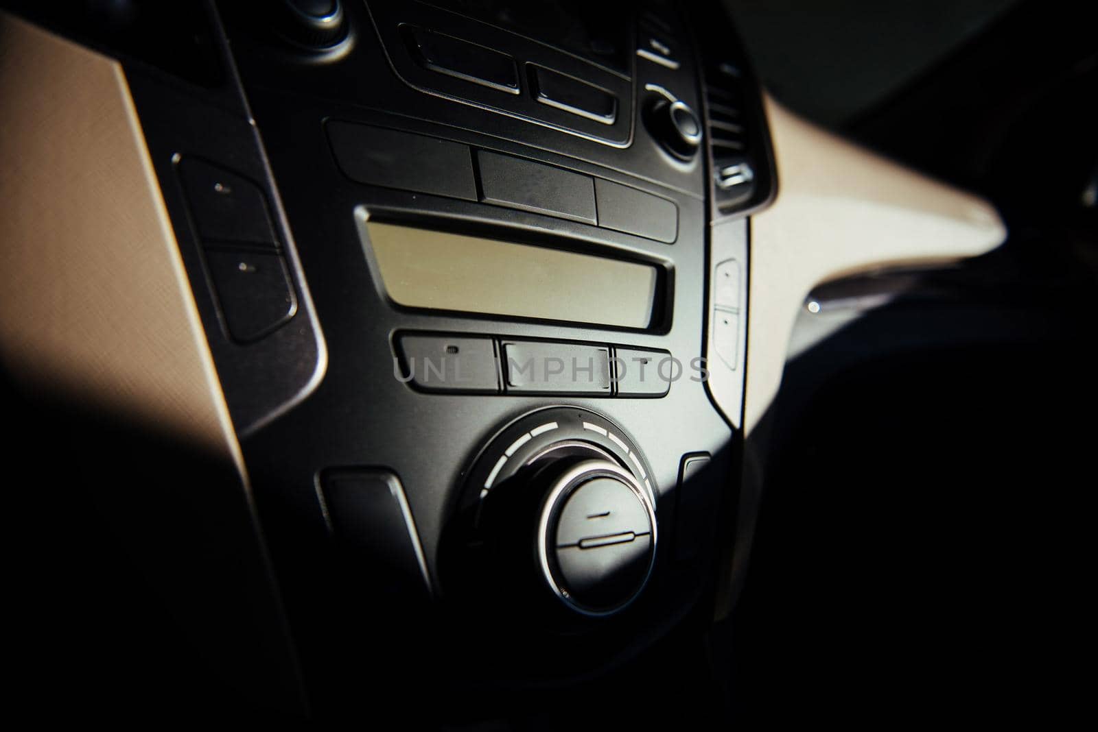 Modern car interior dashboard and steering wheel.