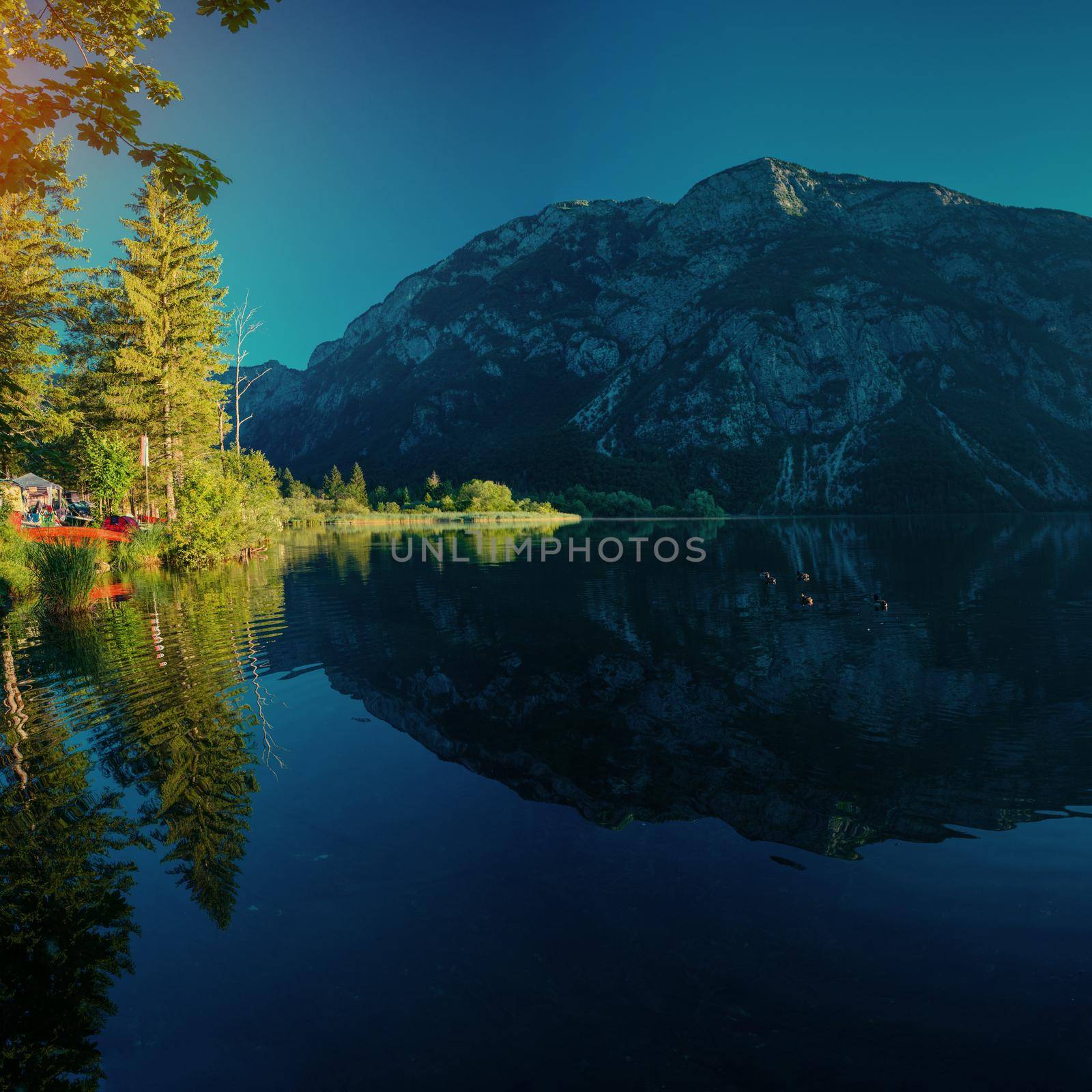 Mountain lake between by mountains. Seaside villa Italy