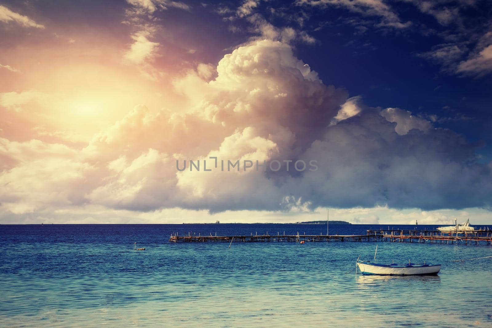 Beautiful summer scene of calm seas and boat.