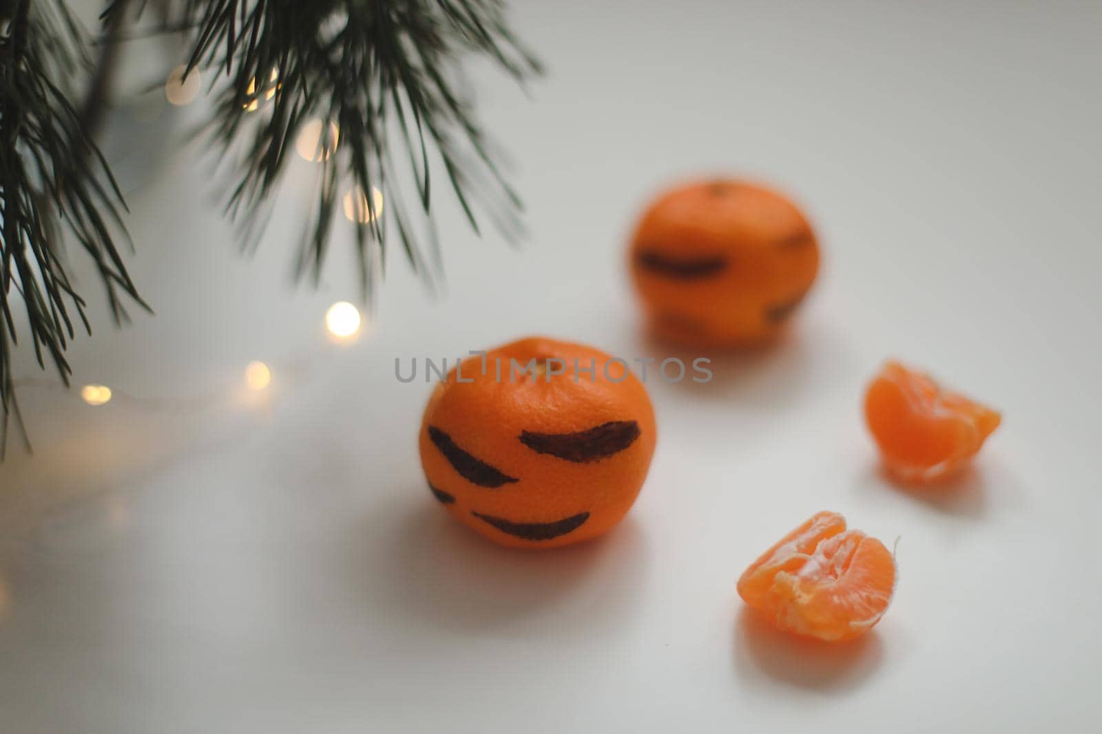 Christmas background with fir tree branches and tangerines. Merry Christmas and Happy New Year Greeting Card. Copy space. Top view. High quality photo