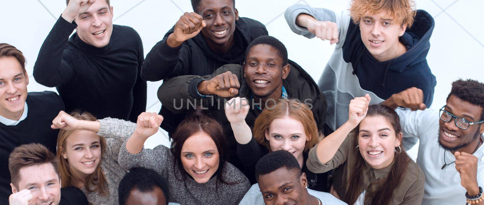 large group of diverse young people looking at the camera . isolated on a white background