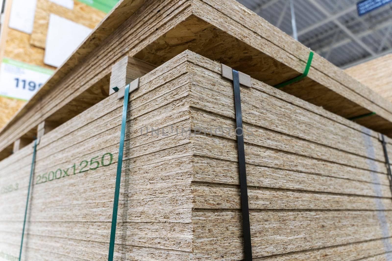 a stack of chipboard in a hardware store. wooden usb sheet. Sale of wooden building materials, repair