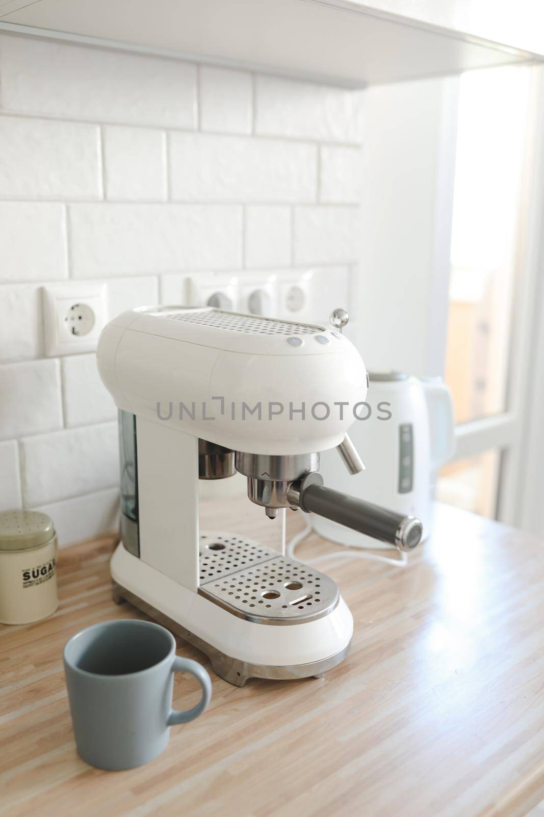 white coffee machine in home interior in the morning