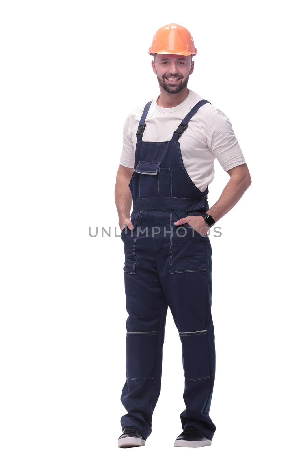 in full growth. confident man in overalls . isolated on white background