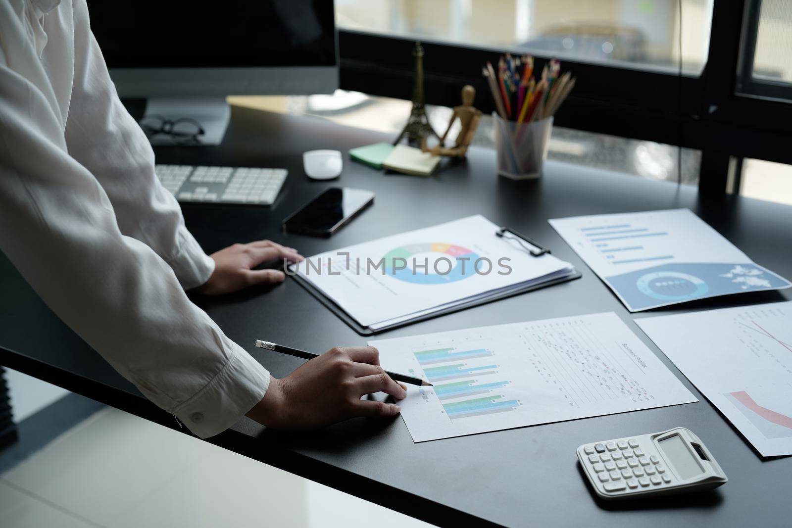Business woman using calculator for do math finance on wooden desk in office and business working background, tax, accounting, statistics and analytic research concept.