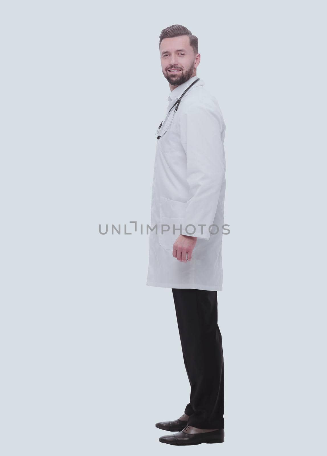 side view. smiling pediatrician doctor with stethoscope by asdf