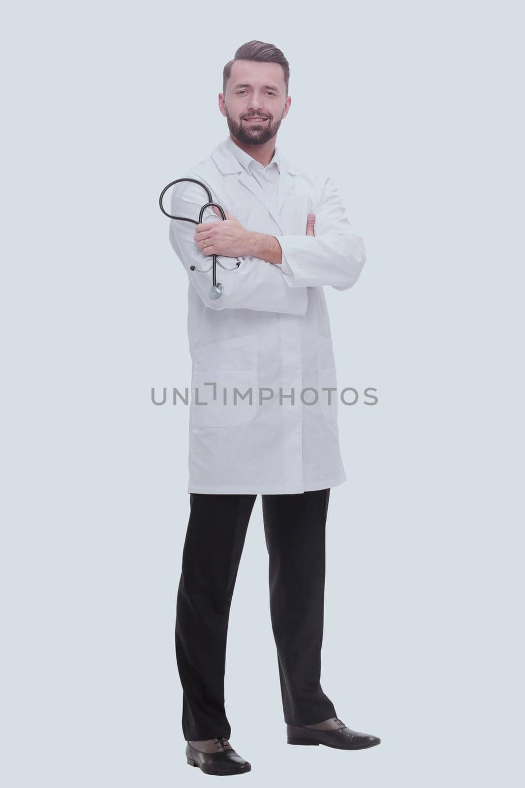 in full growth.portrait of confident doctor therapist. isolated on white