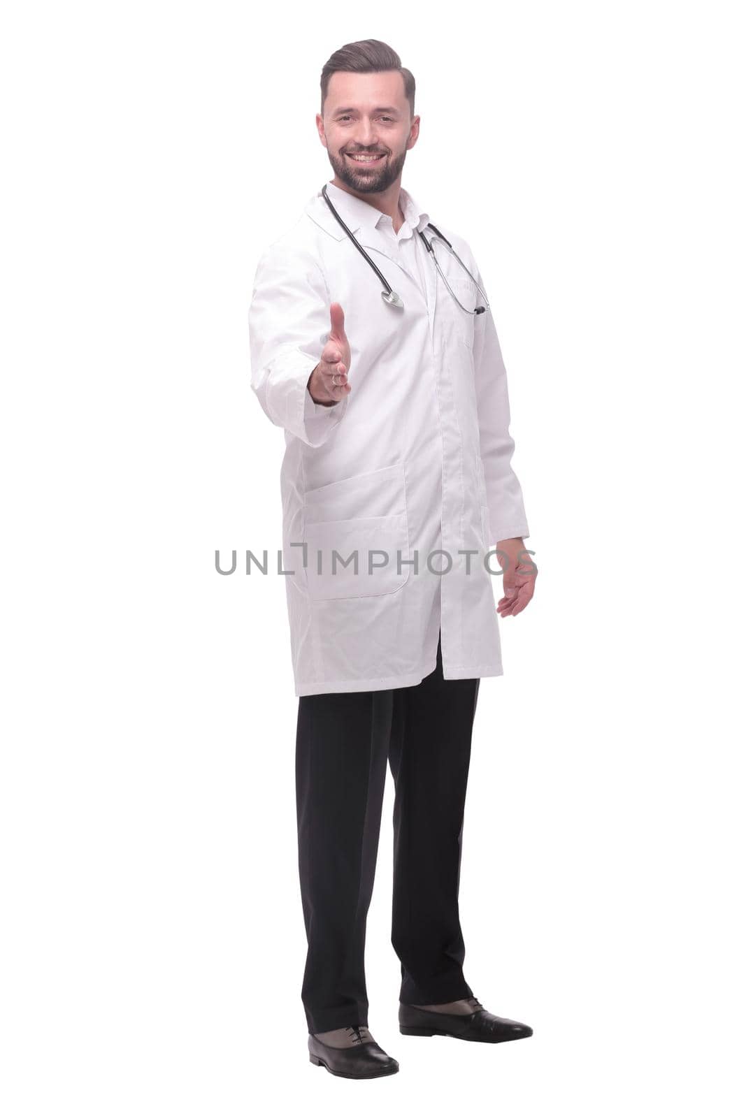 in full growth. the medical doctor holding out his hand for a handshake. isolated on white