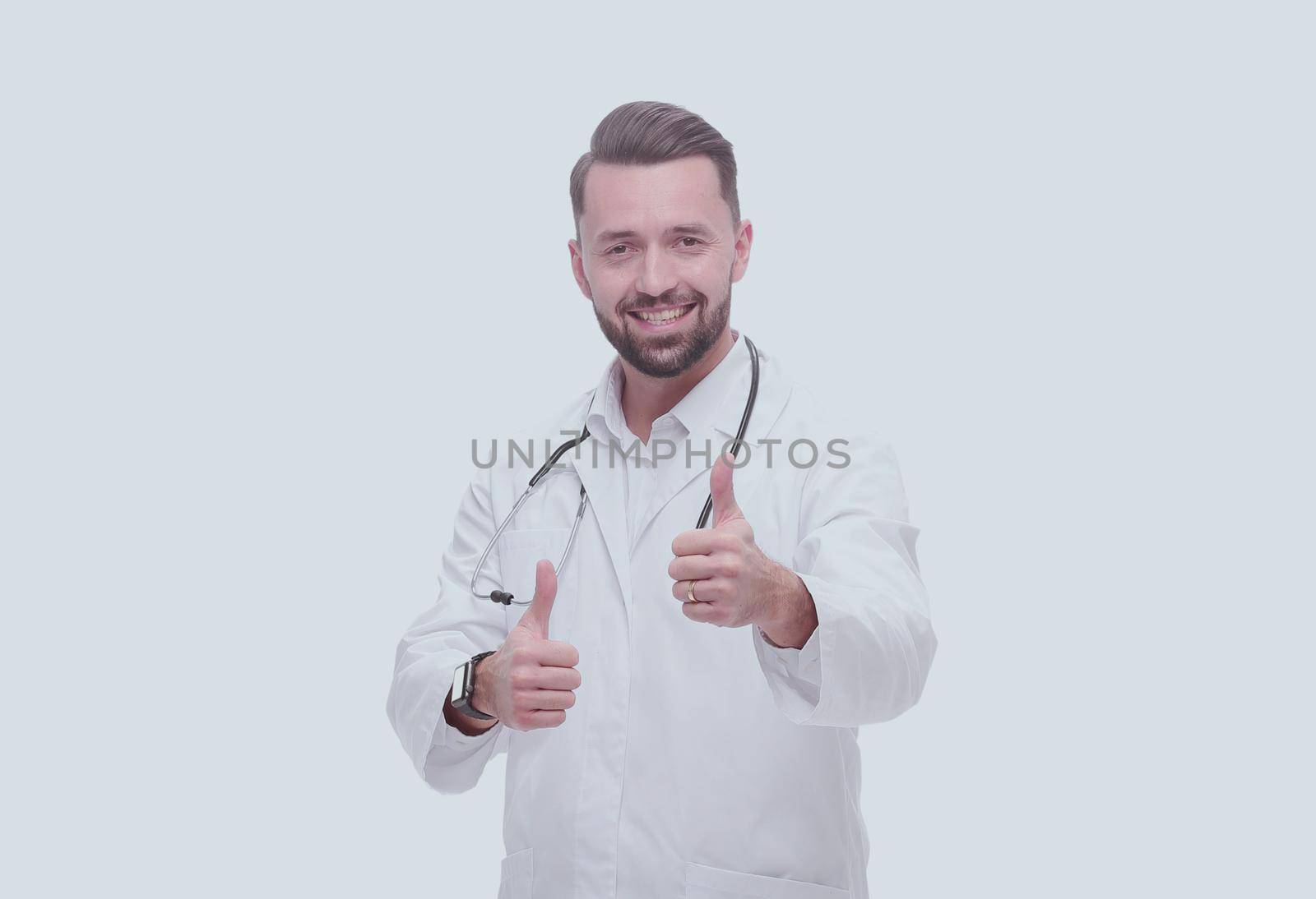 in full growth. smiling medical professional showing thumbs up .isolated on white background