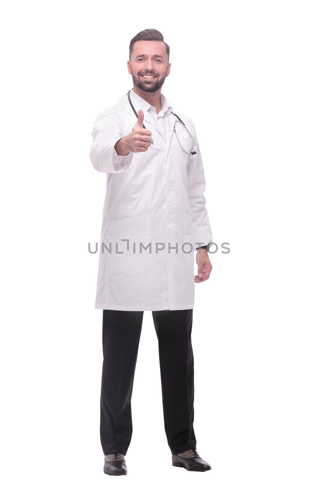 in full growth. smiling medical professional showing thumbs up .isolated on white background