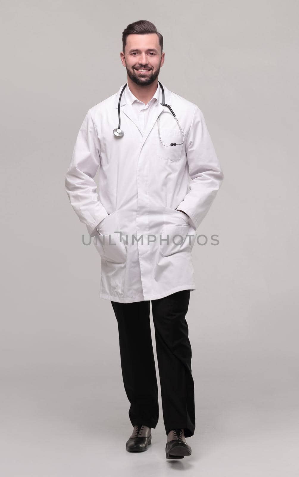 in full growth. a successful doctor is a therapist with a stethoscope .isolated on white