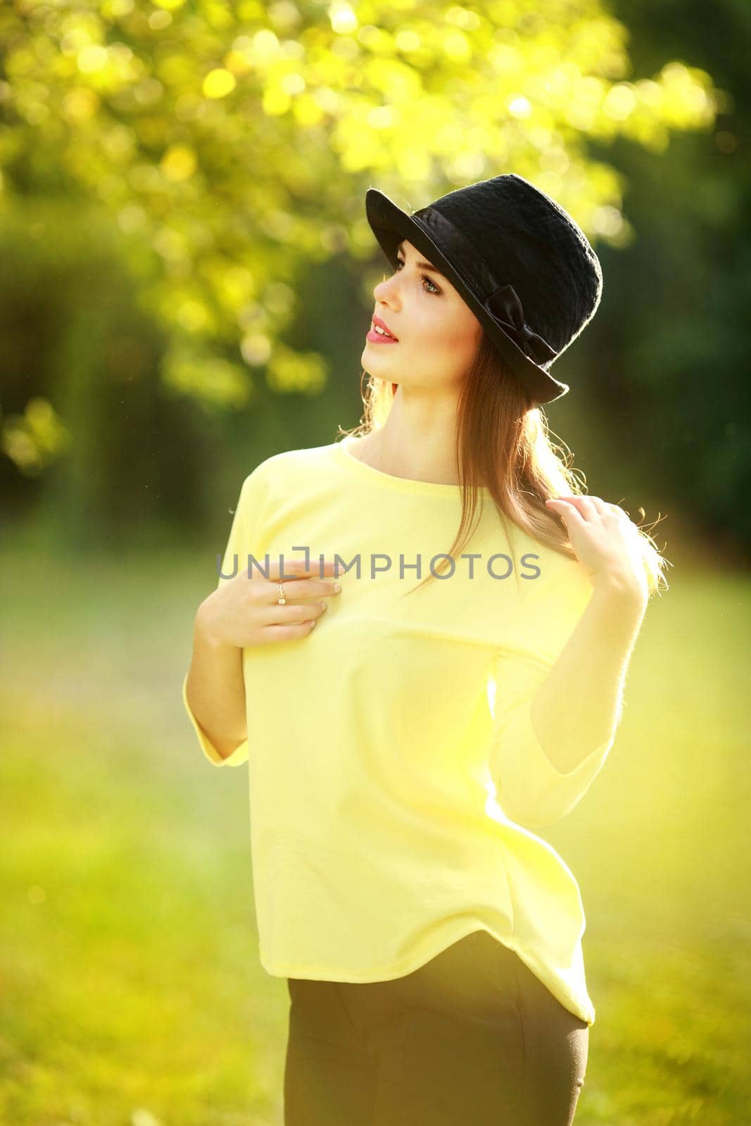 Portrait of beautiful young woman with sunny day