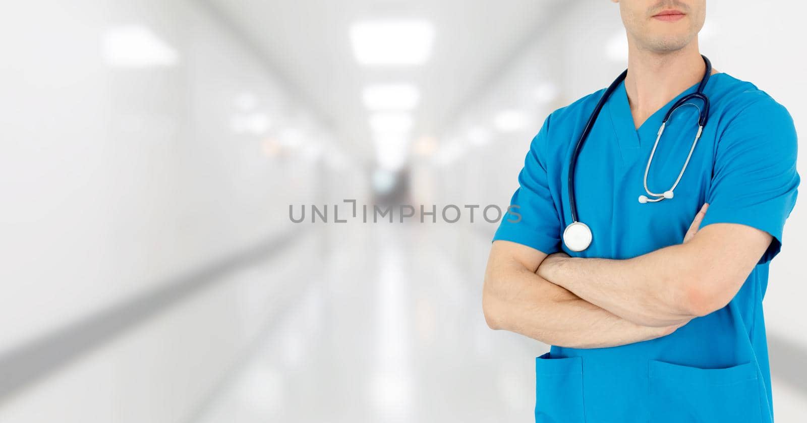 Young male doctor working at the hospital. Medical healthcare and doctor staff service.