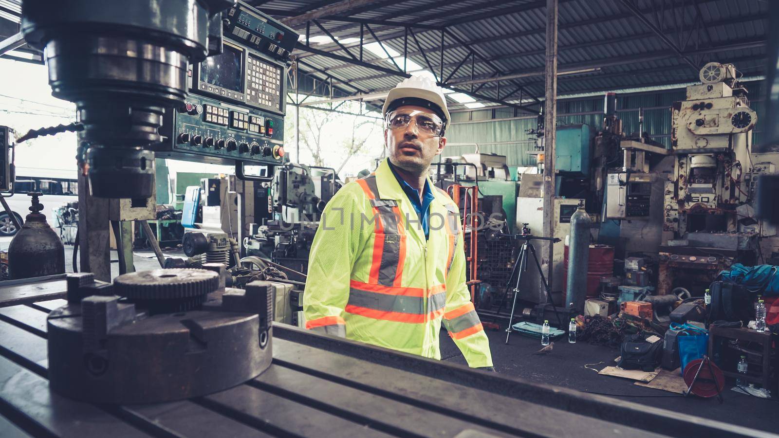 Smart factory worker using machine in factory workshop . Industry and engineering concept.