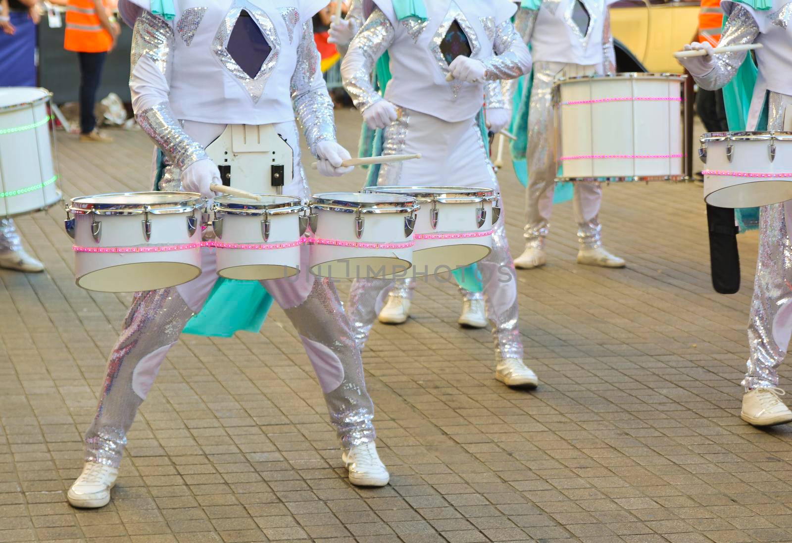 Circus artists with drums participate in the performance