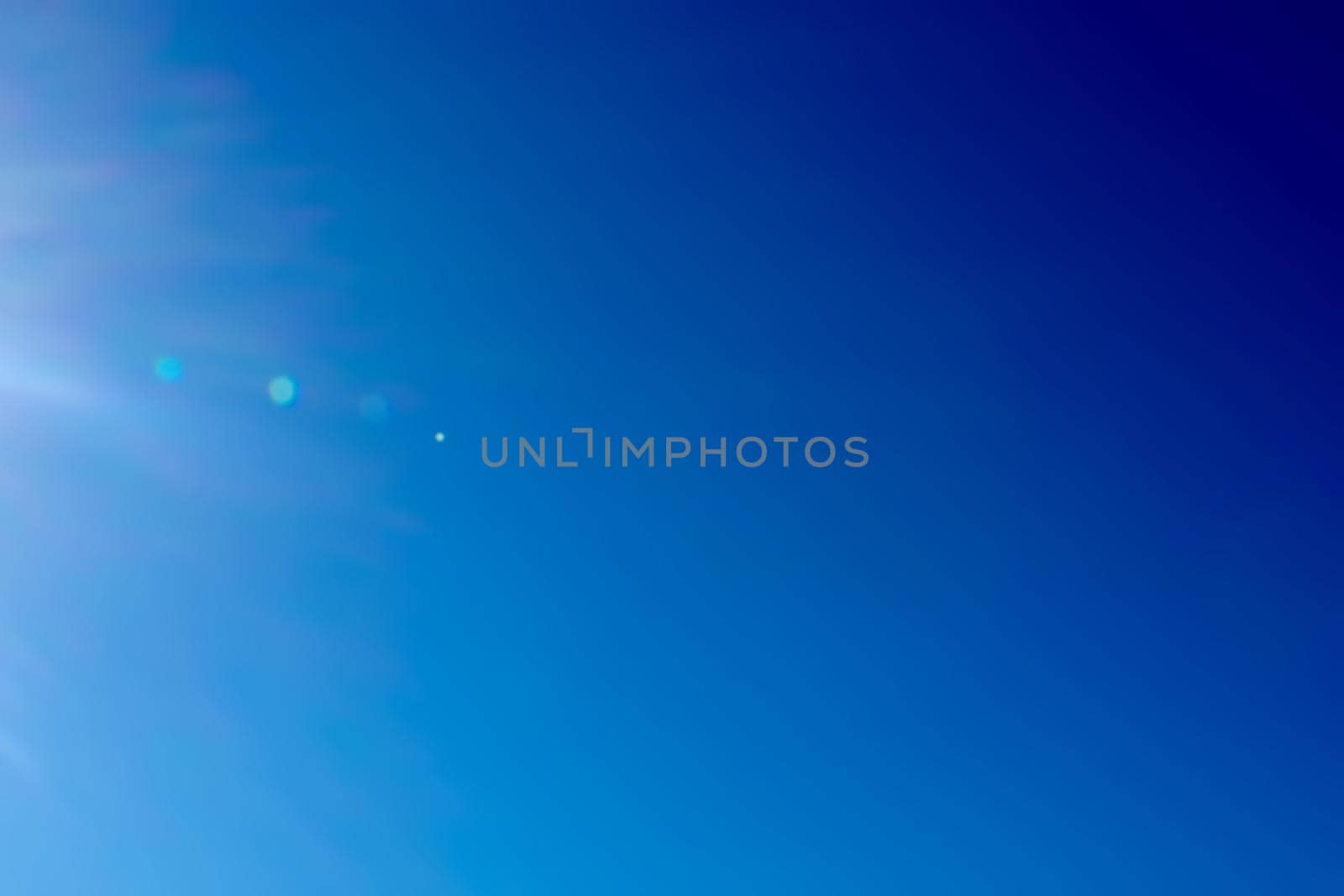 Blue sky bright summer rays of the sun by Serhii_Voroshchuk