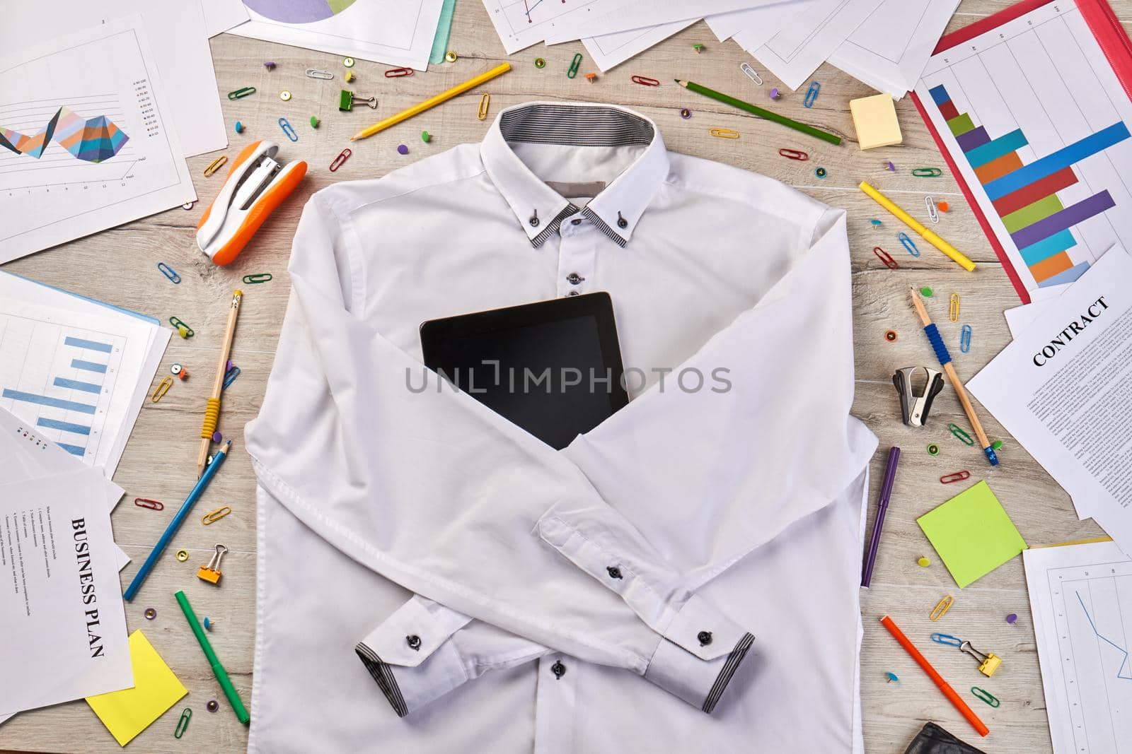 Top view flat lay white shirt with tablet device. by super_picture