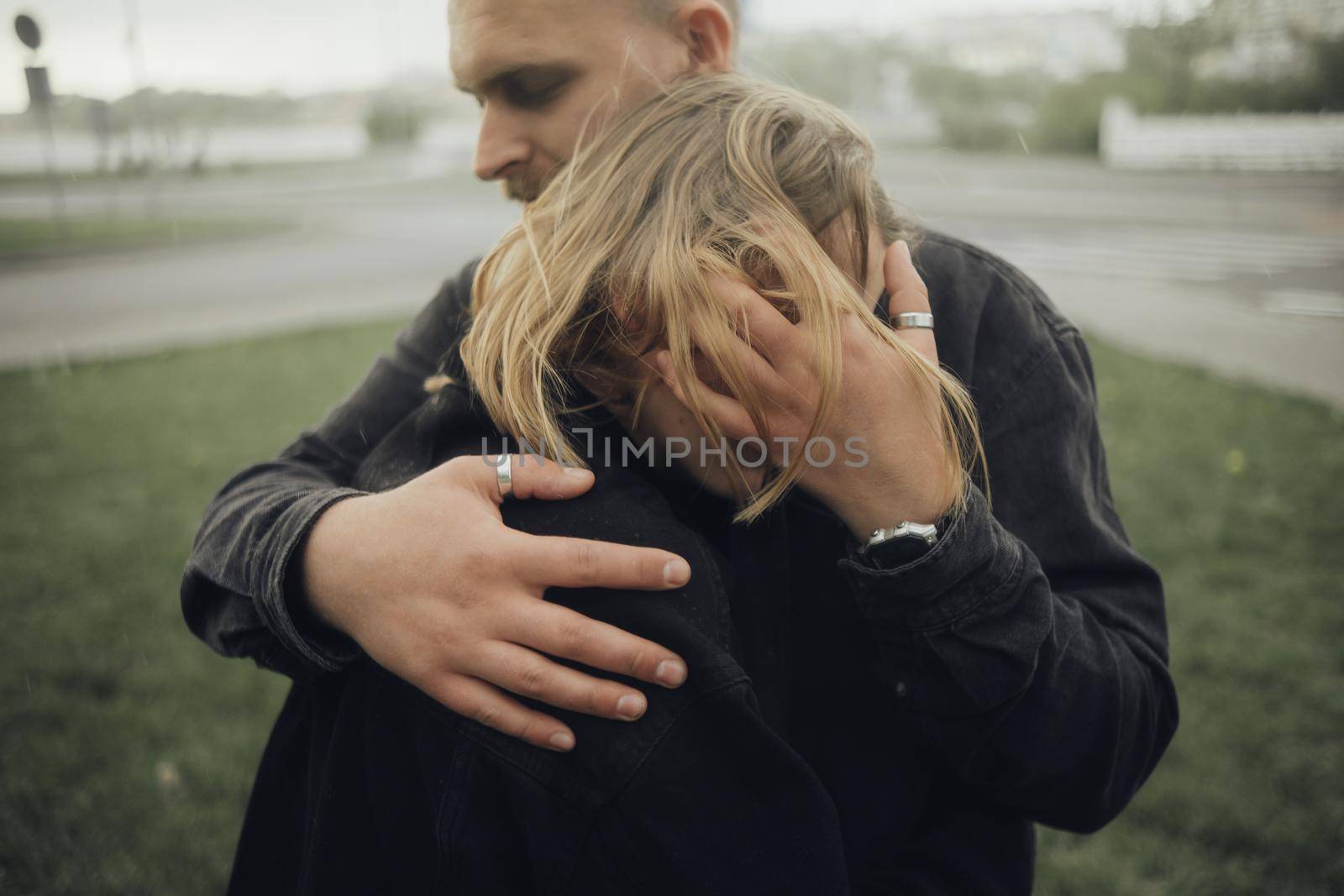 the guy hugs his beloved very gently and sensually, selective focus by Symonenko