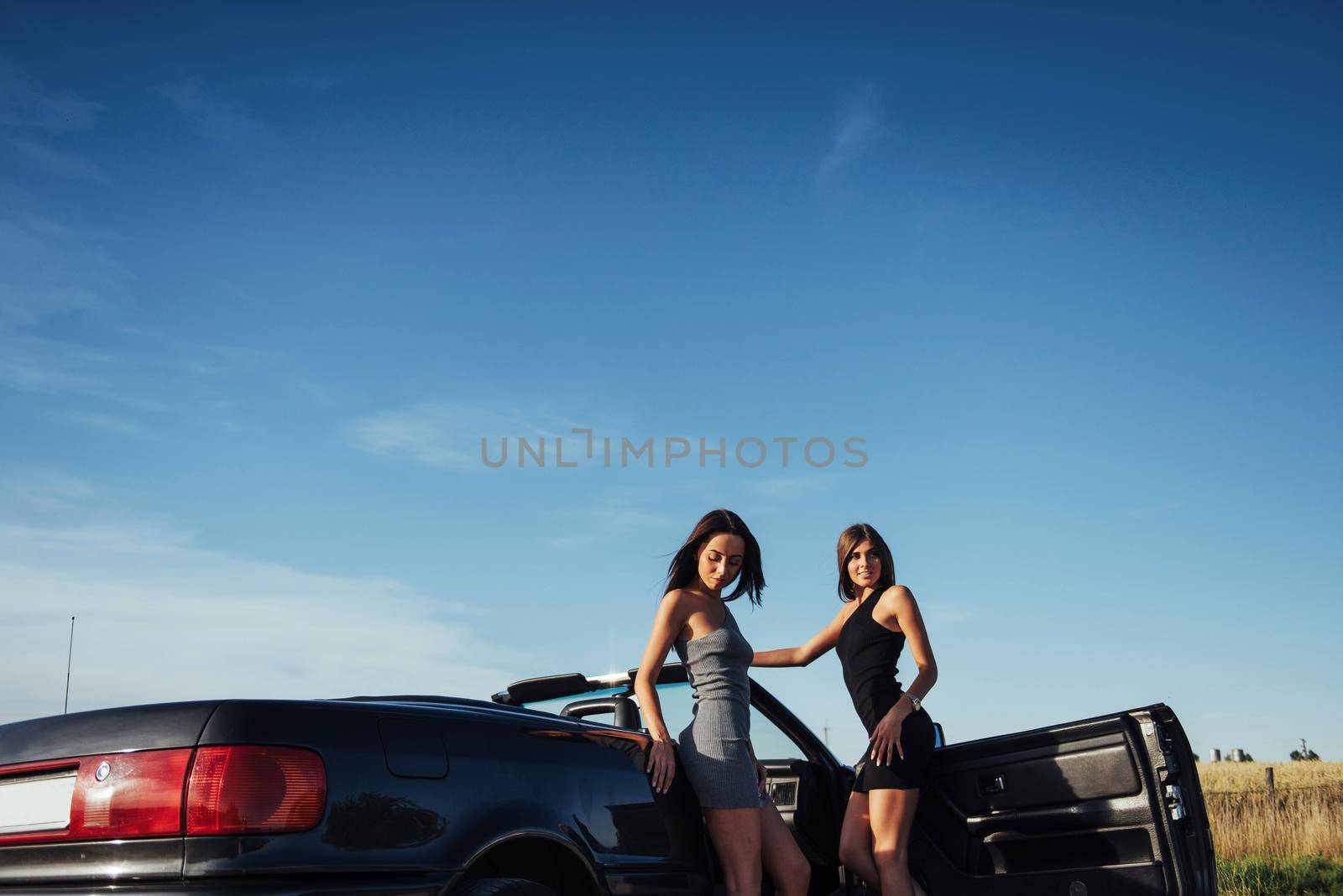 Young women at a photo shoot. by Standret