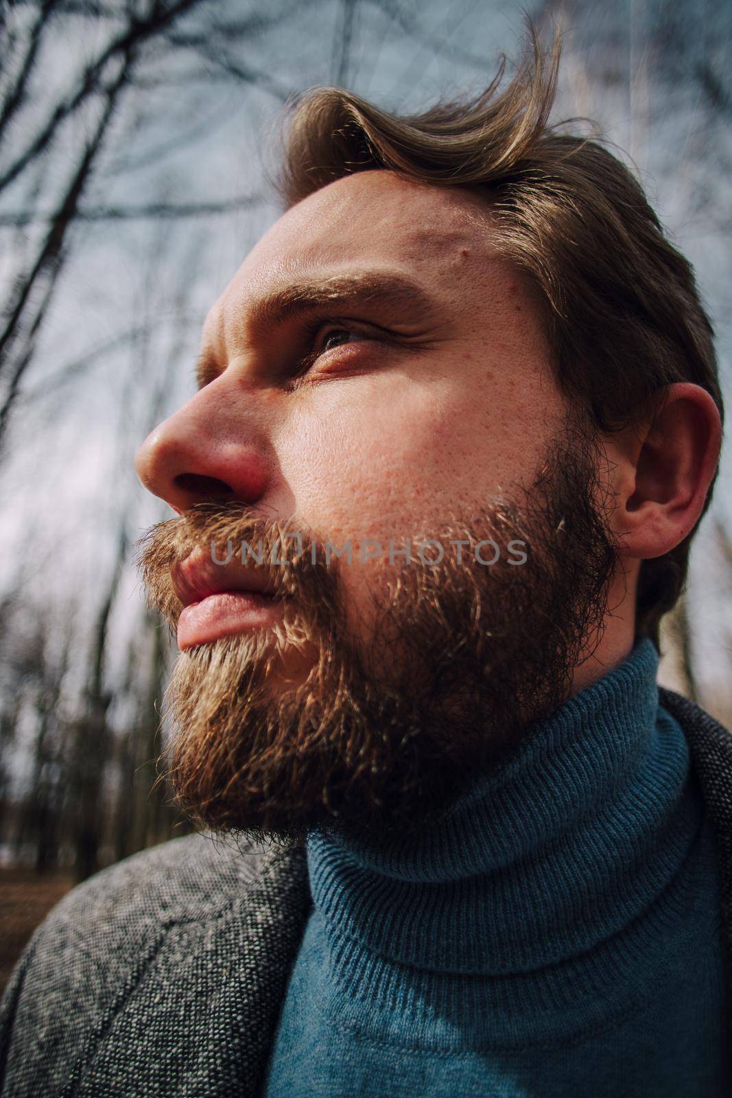 Male portrait. Very amazed face. Perhaps from a surprise. Widespread eyes and mouth. Isolated on white. Brutal stylish guy with a beard and mustache. Nude shoulders. European appearance. Closeup.