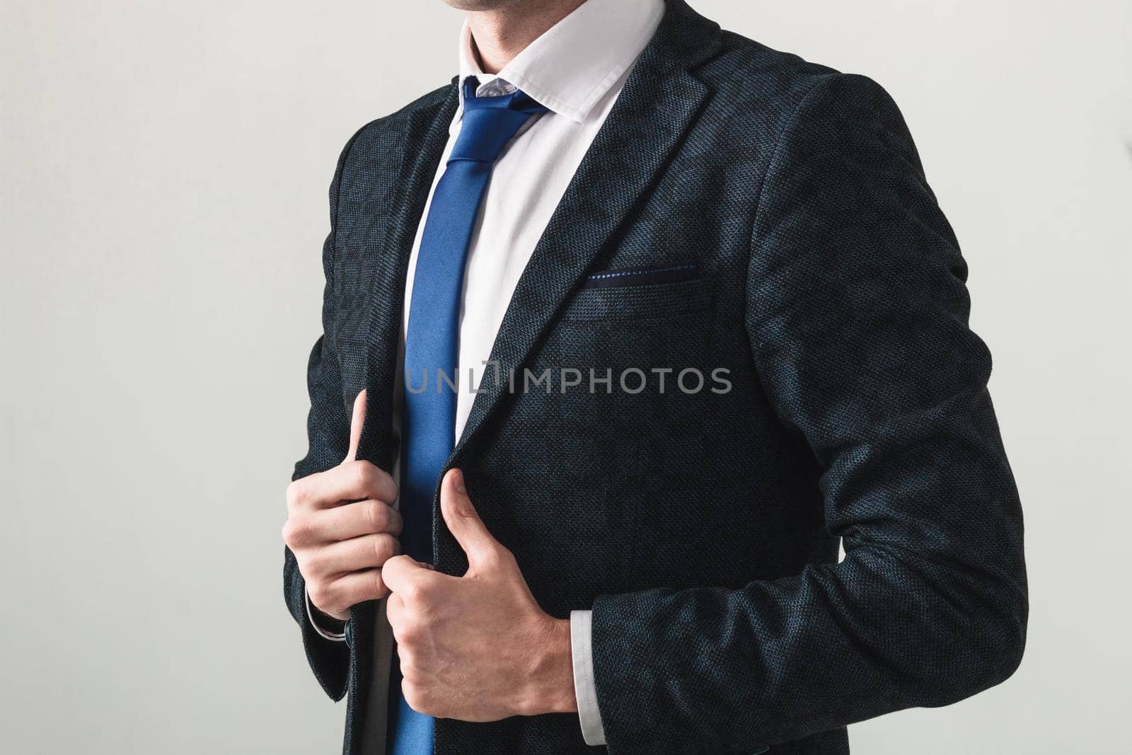 Portrait of a handsome CEO cross hands blue jacket