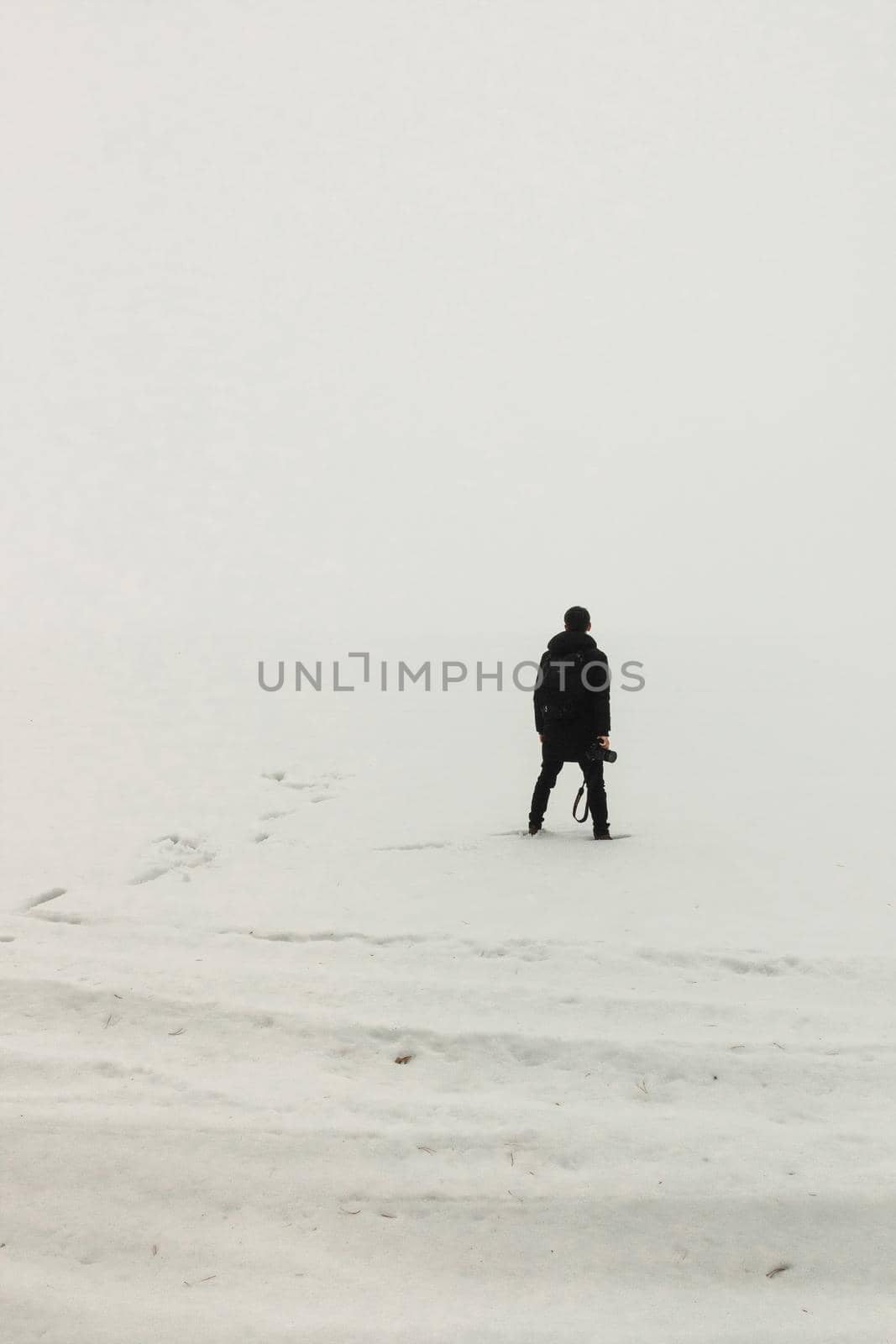 man standing on the ice misty morning simple minimalist photography one person minimalism