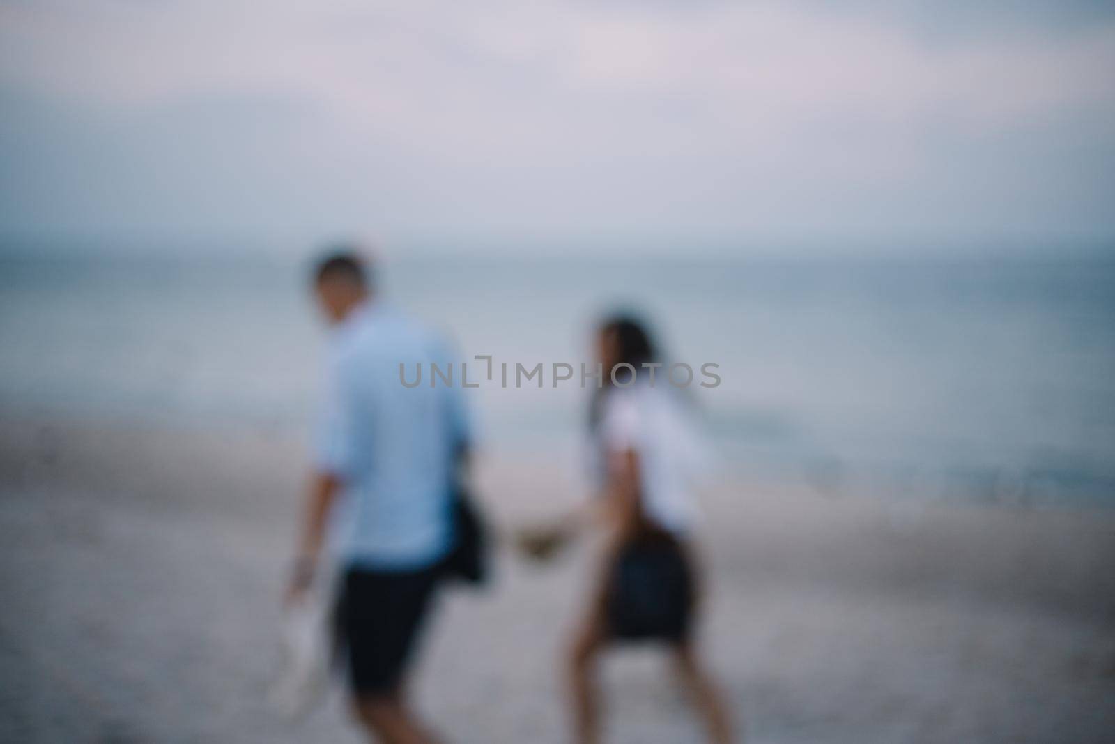 Couple at the seaside image blur romantic vintage style.