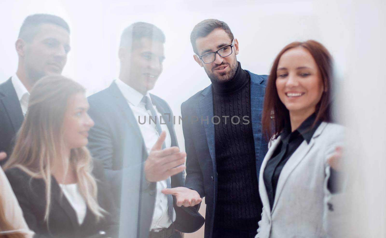 businesswoman pointing to an ad on a glass Board. business concept