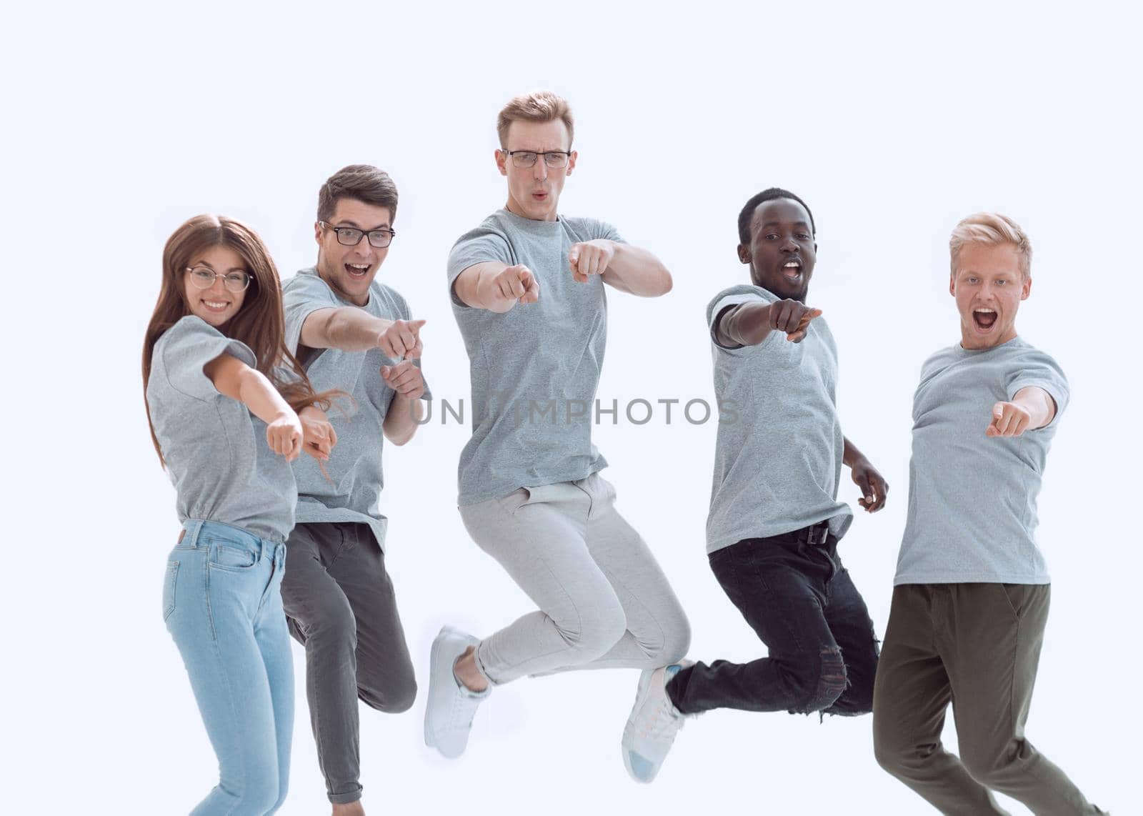 casual group of happy young people jumping isolated over a white background