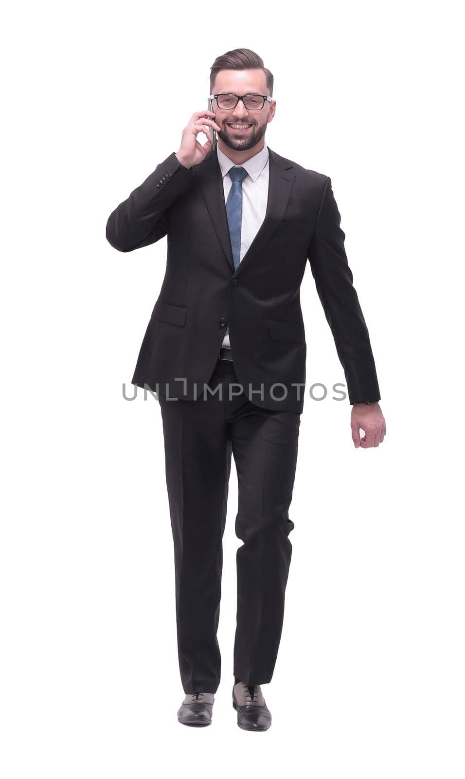 modern businessman talking on mobile phone. isolated on white by asdf