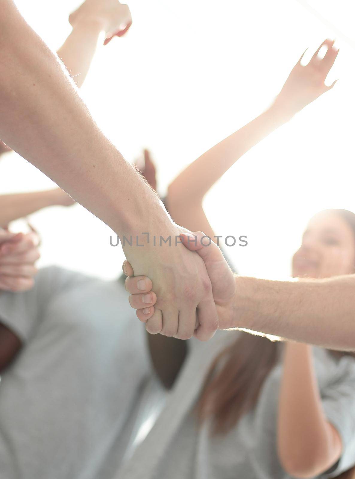 confident group of young men pointing ahead. photo with copy space