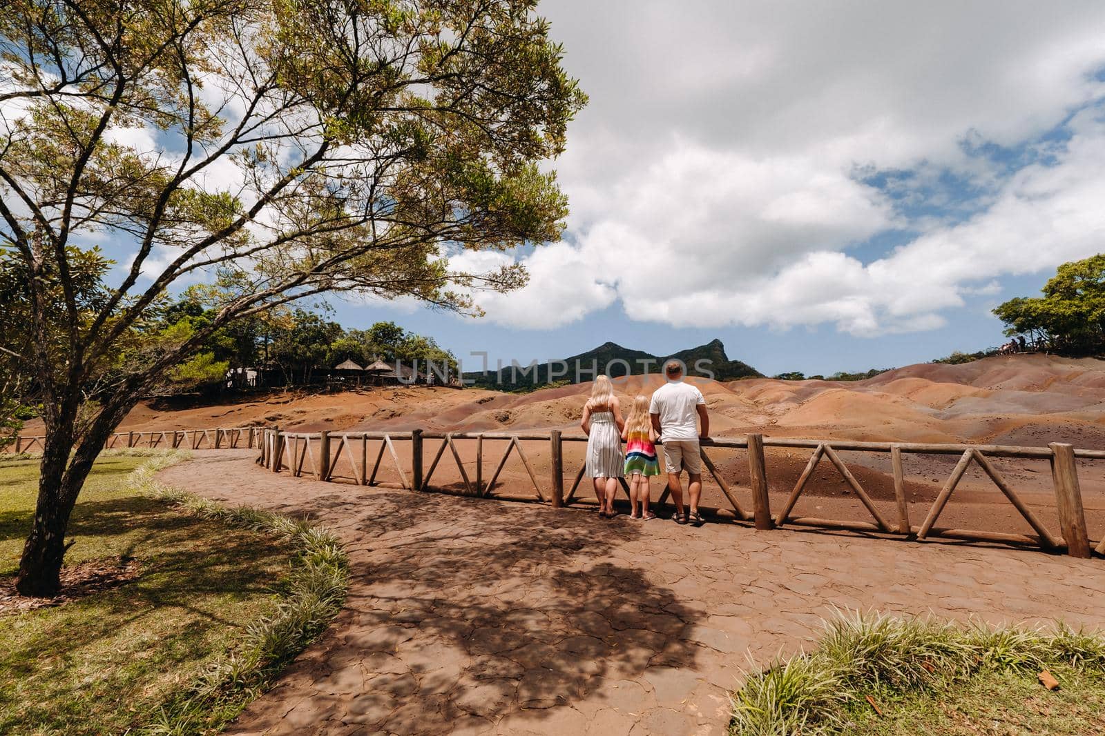 family against the background of seven-Colored lands in Mauritius, nature reserve, Chamarel Sands.Mauritius island by Lobachad