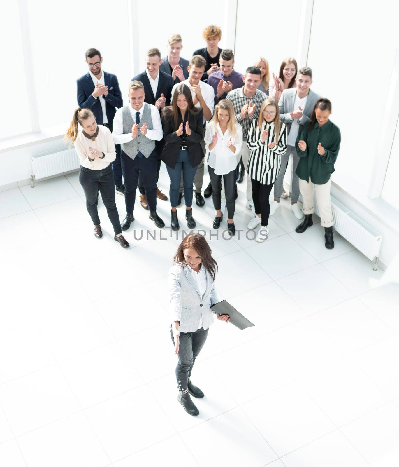 top view. female leader standing at the front of the business team . business concept