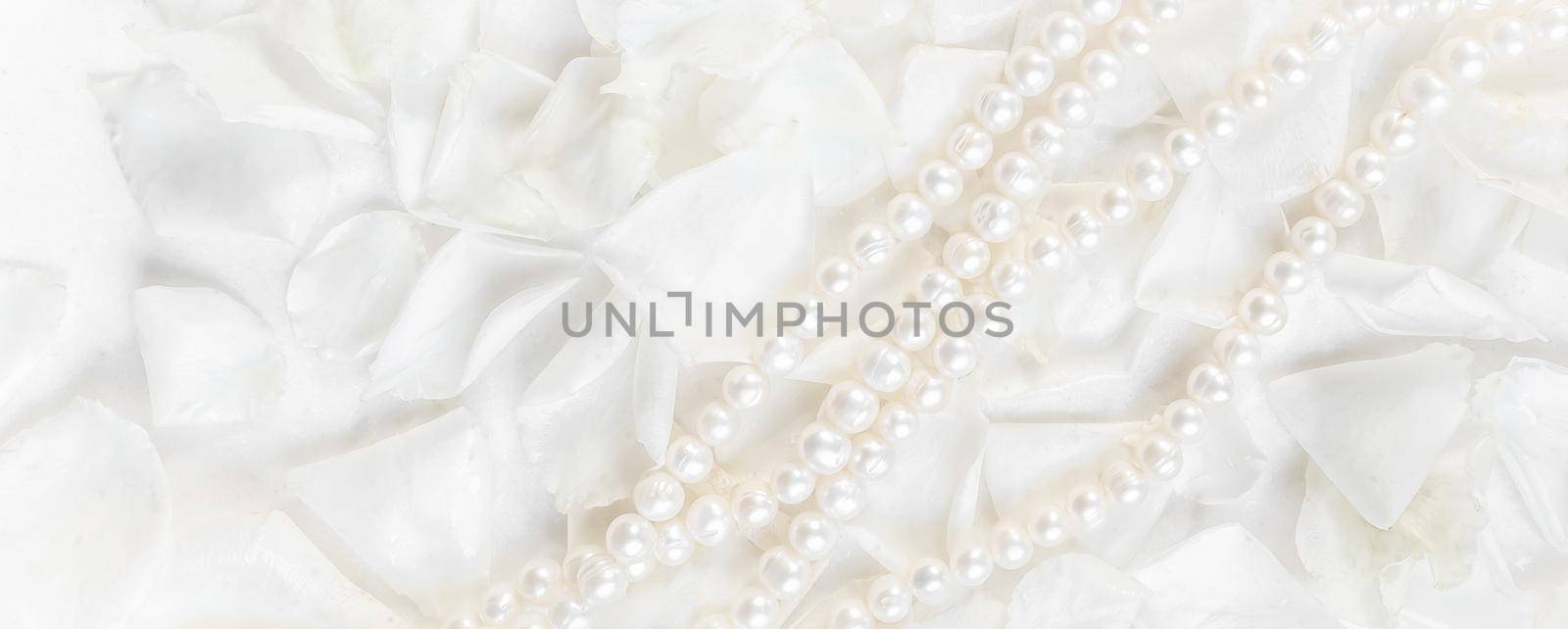 Pearl necklace on a background of white rose petals. Ideal for greeting cards for wedding, birthday, Valentine's Day, Mother's Day by Olayola