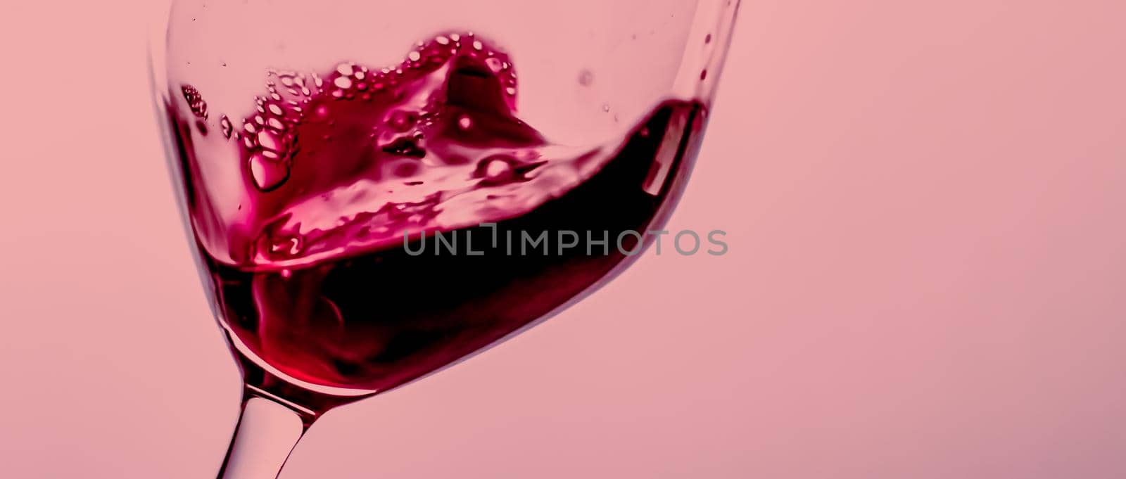Red wine in crystal glass, alcohol drink and luxury aperitif, oenology and viticulture product.