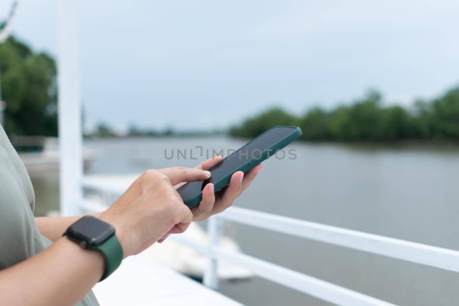 Woman hand using smartphone to do work business, social network, communication concept.