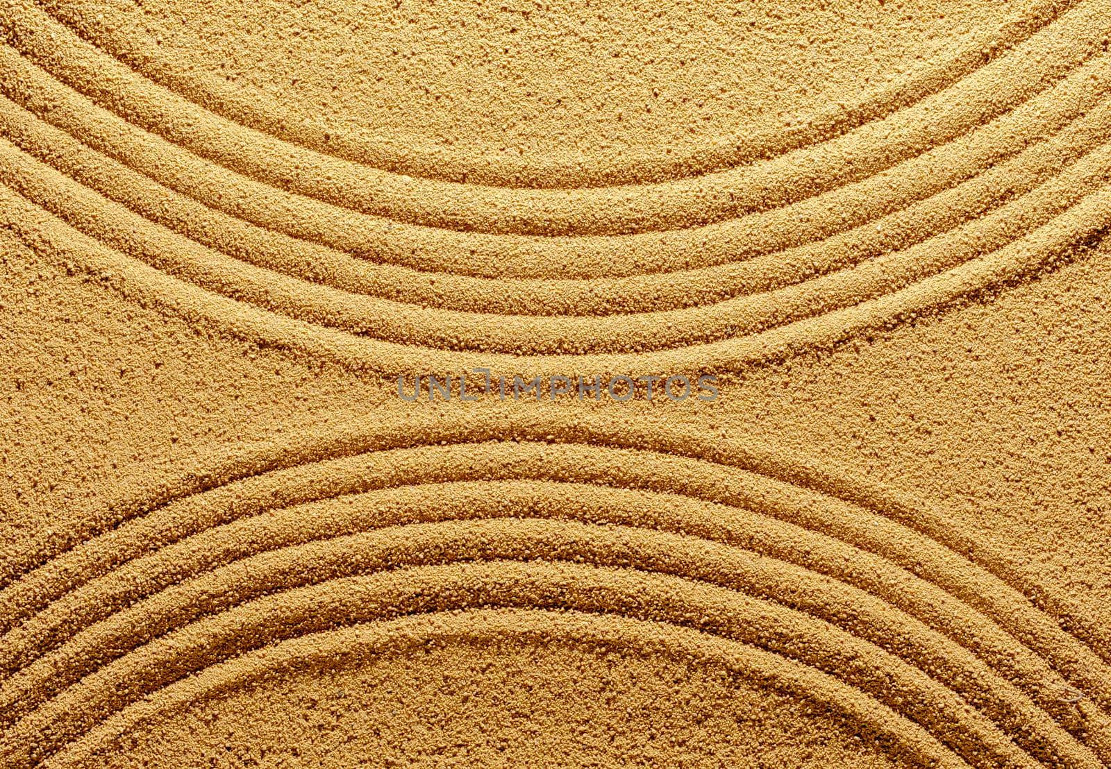 Pattern of smooth abstract lines on the summer sand. Creative minimal concept of tropics or japanese meditation.