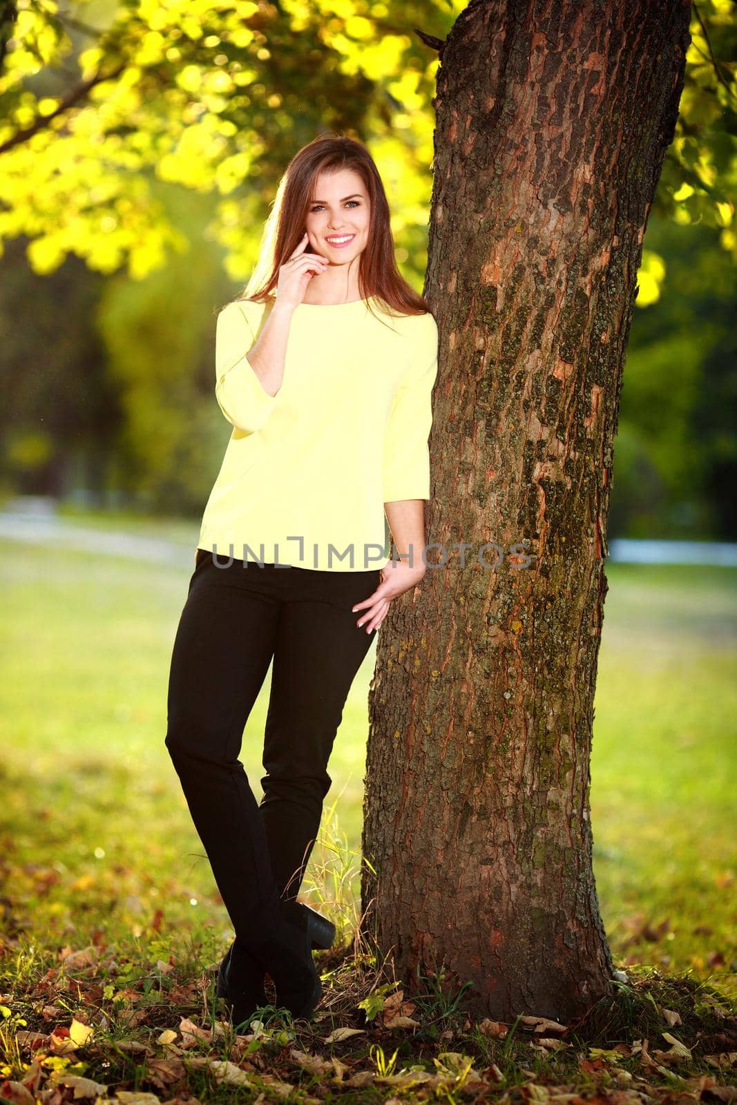 Attractive young woman enjoying her time outside in park